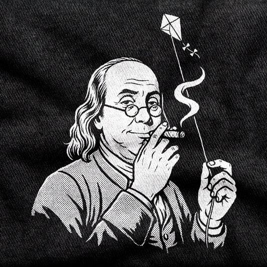 Benjamin Franklin High as a Kite design printed on a black cotton tee, close-up