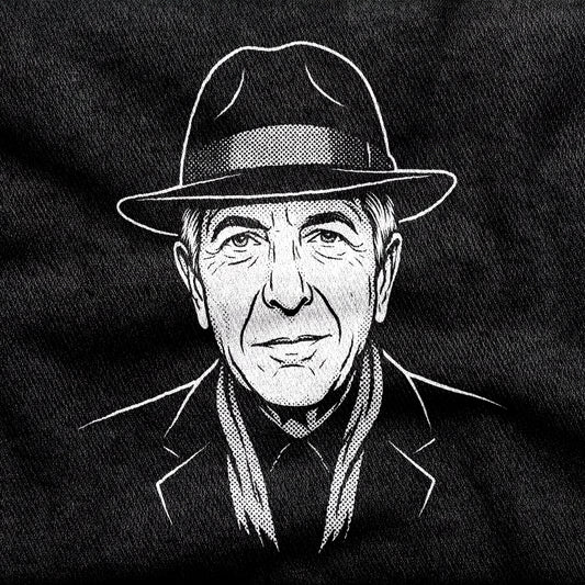Leonard Cohen design printed on a black cotton tee, close-up