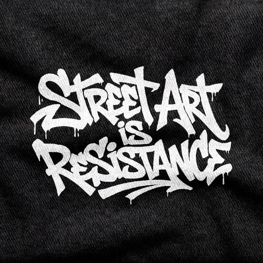 Street Art is Resistance design printed on a black cotton tee, close-up