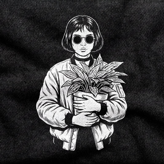 Mathilda design printed on a black cotton tee, close-up