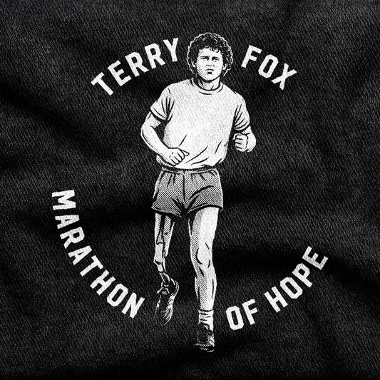 Terry Fox Marathon of Hope design printed on a black cotton tee, close-up
