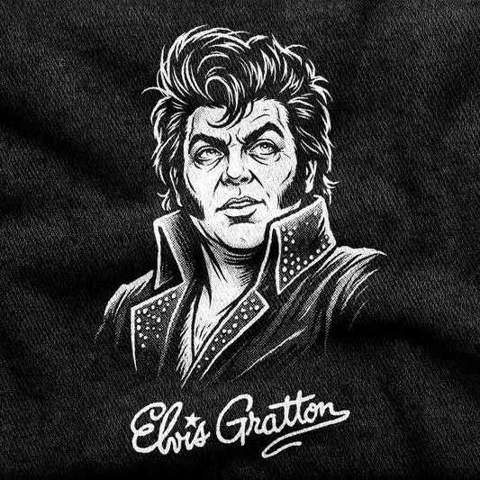Elvis Gratton design printed on a black cotton tee, close-up