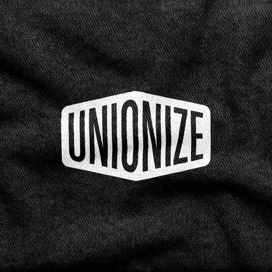 Unionize design printed on a black cotton tee, close-up