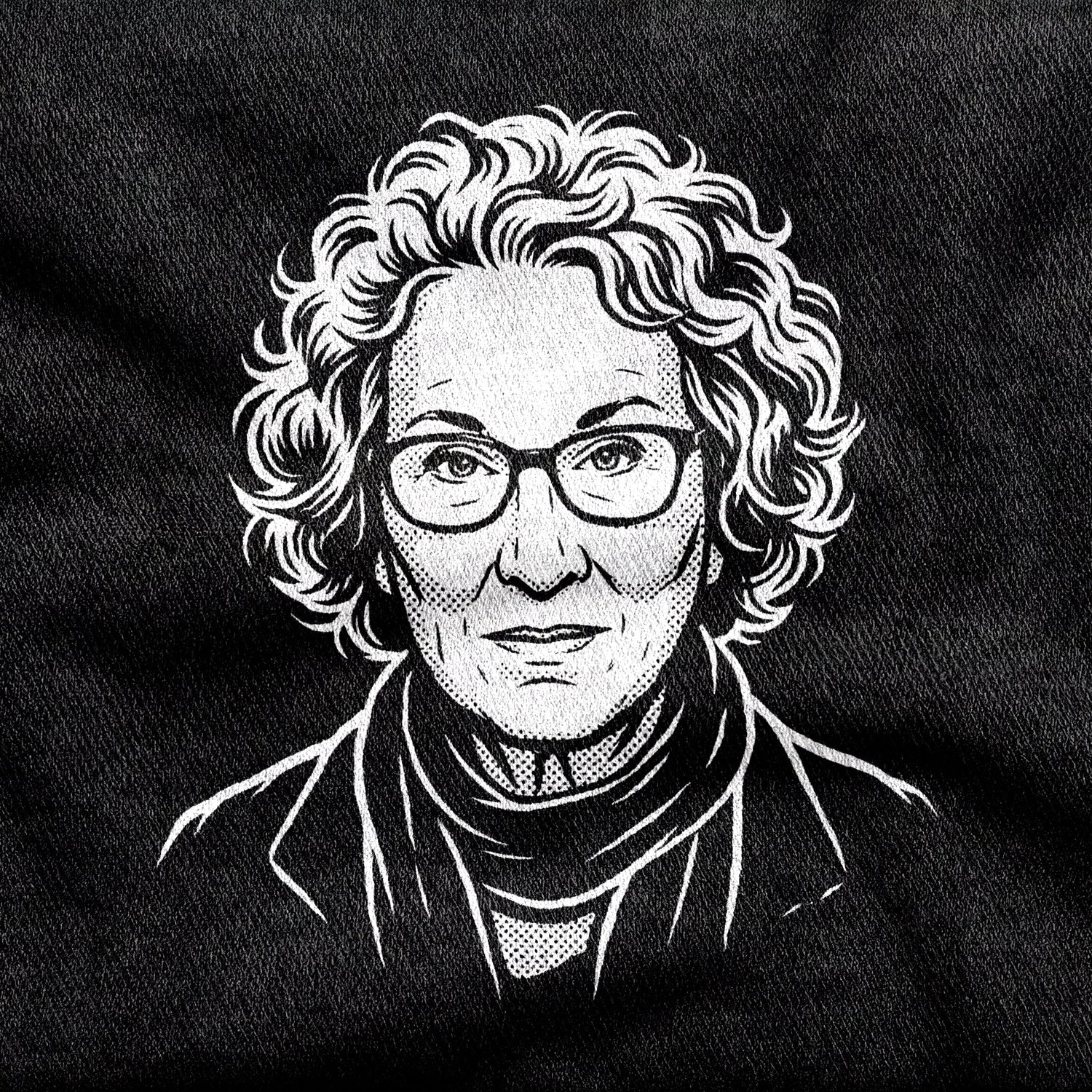 Margaret Atwood design printed on a black cotton tee, close-up