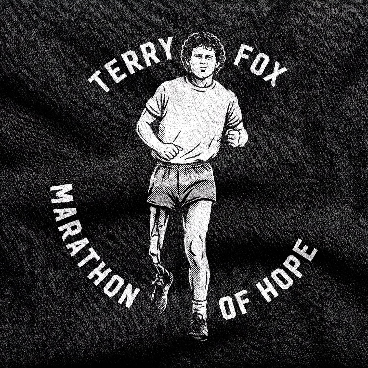 Terry Fox design printed on a black cotton tee, close-up