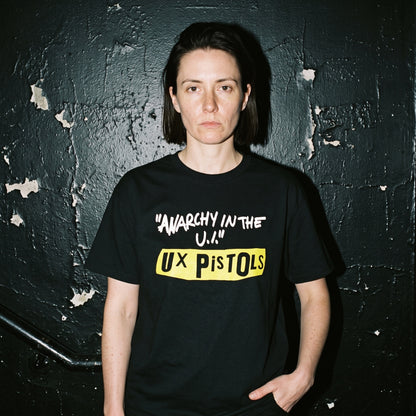 Woman wearing the UX Pistols black graphic tee