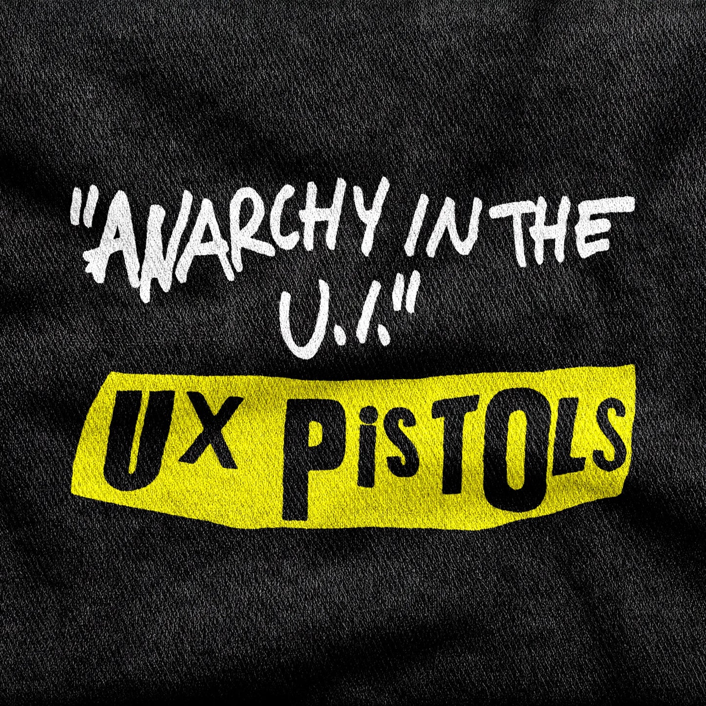 UX Pistols design printed on a black cotton tee, close-up