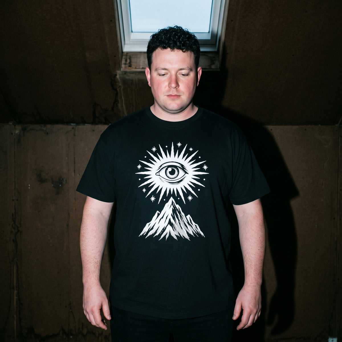 Man wearing the Amon Düül II black graphic tee
