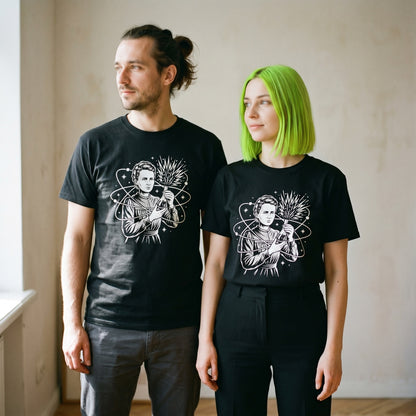 Two models wearing the Breaking Atoms Marie Curie black graphic tee