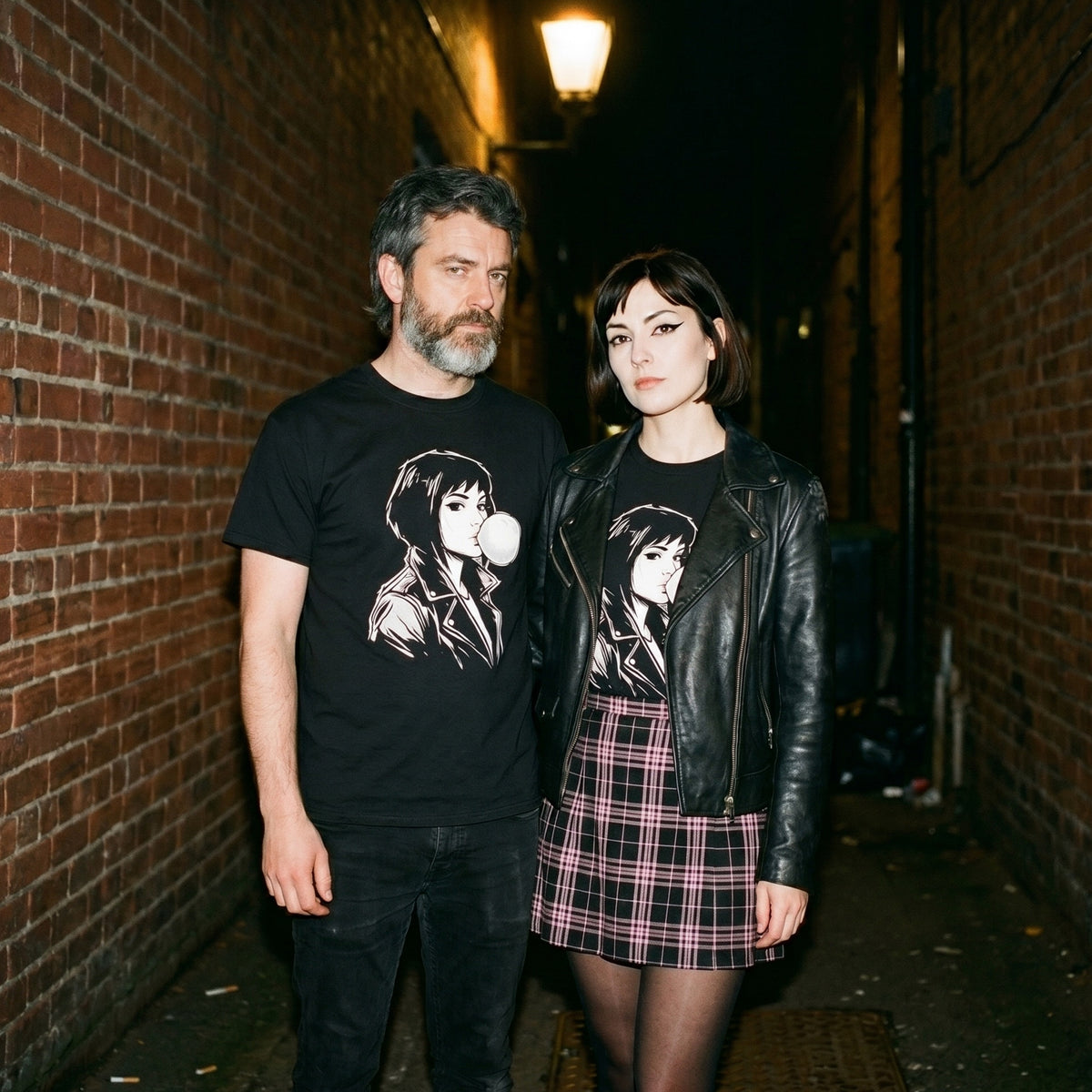 Two models wearing the Bubbly Lass black graphic tee