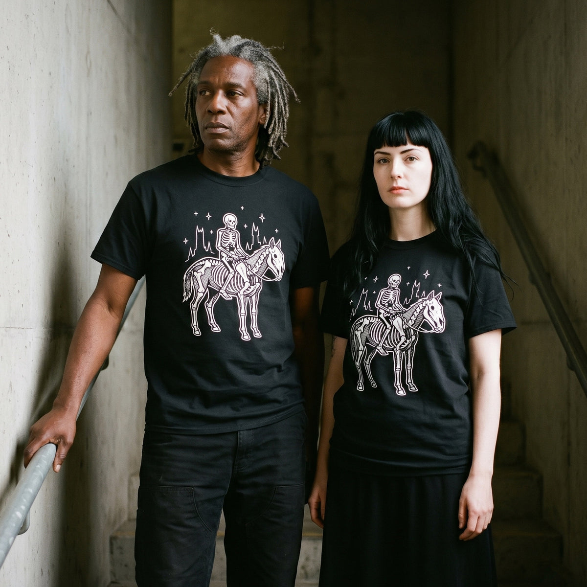 Two models wearing the Death black graphic tee