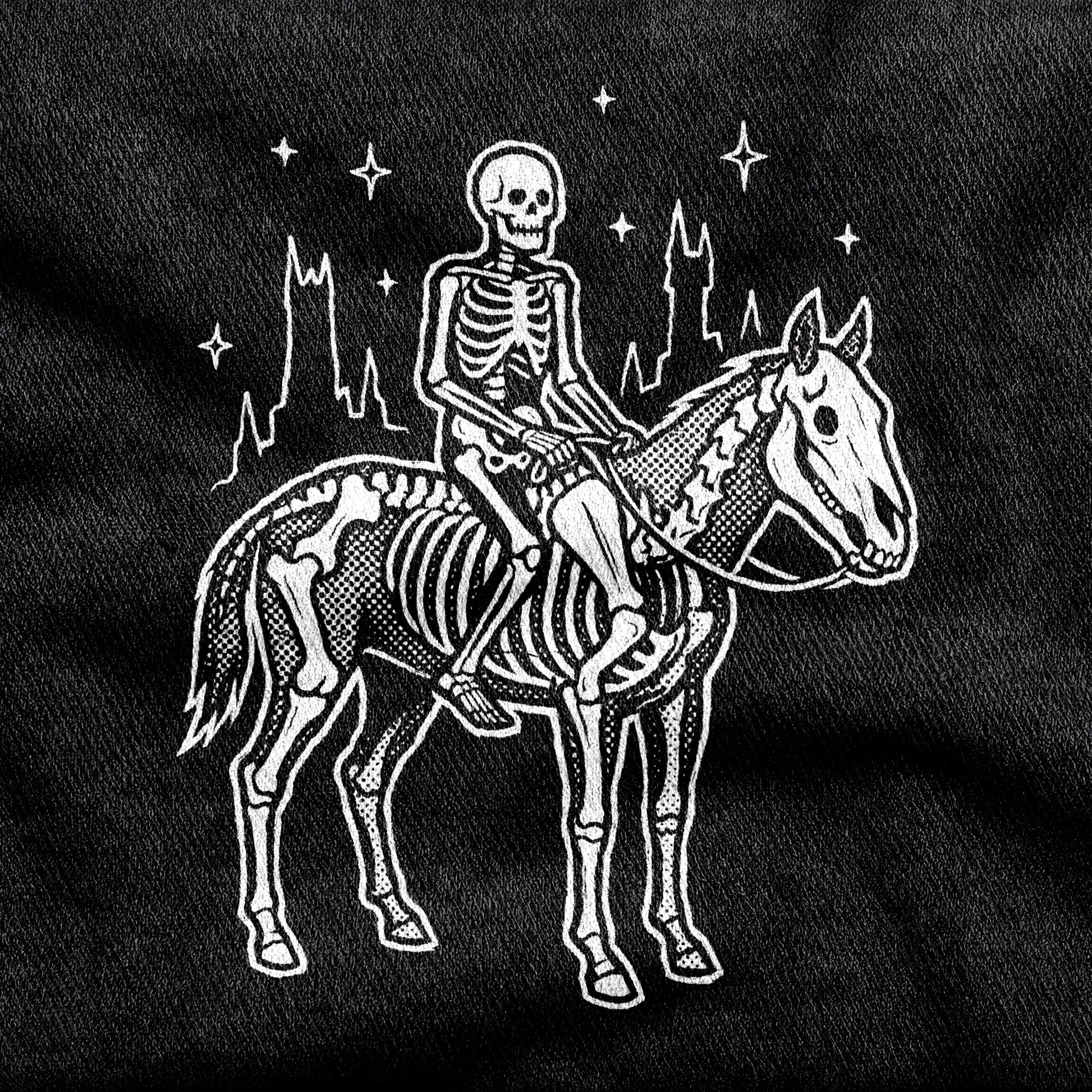 Death design printed on a black cotton tee, close-up