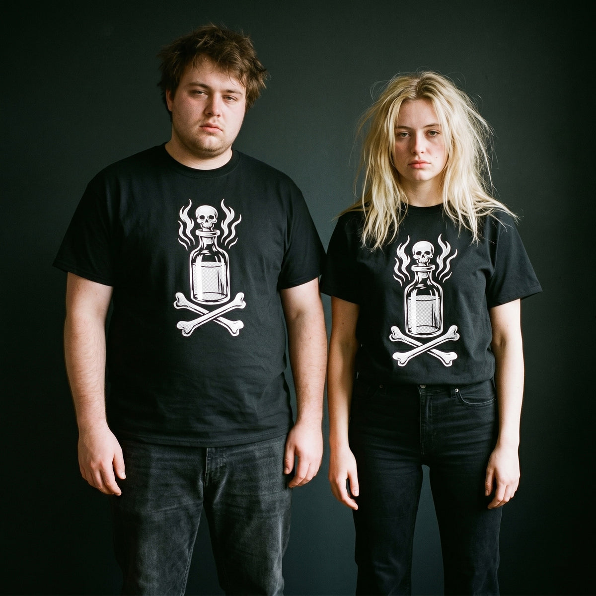 Two models wearing the Drink Your Poison black graphic tee