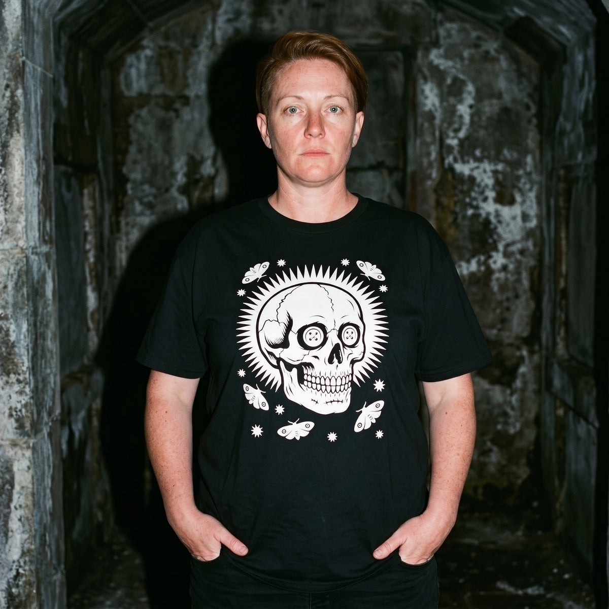 Woman wearing the Memento Vivere black graphic tee