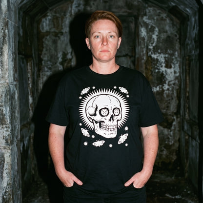 Woman wearing the Memento Vivere black graphic tee