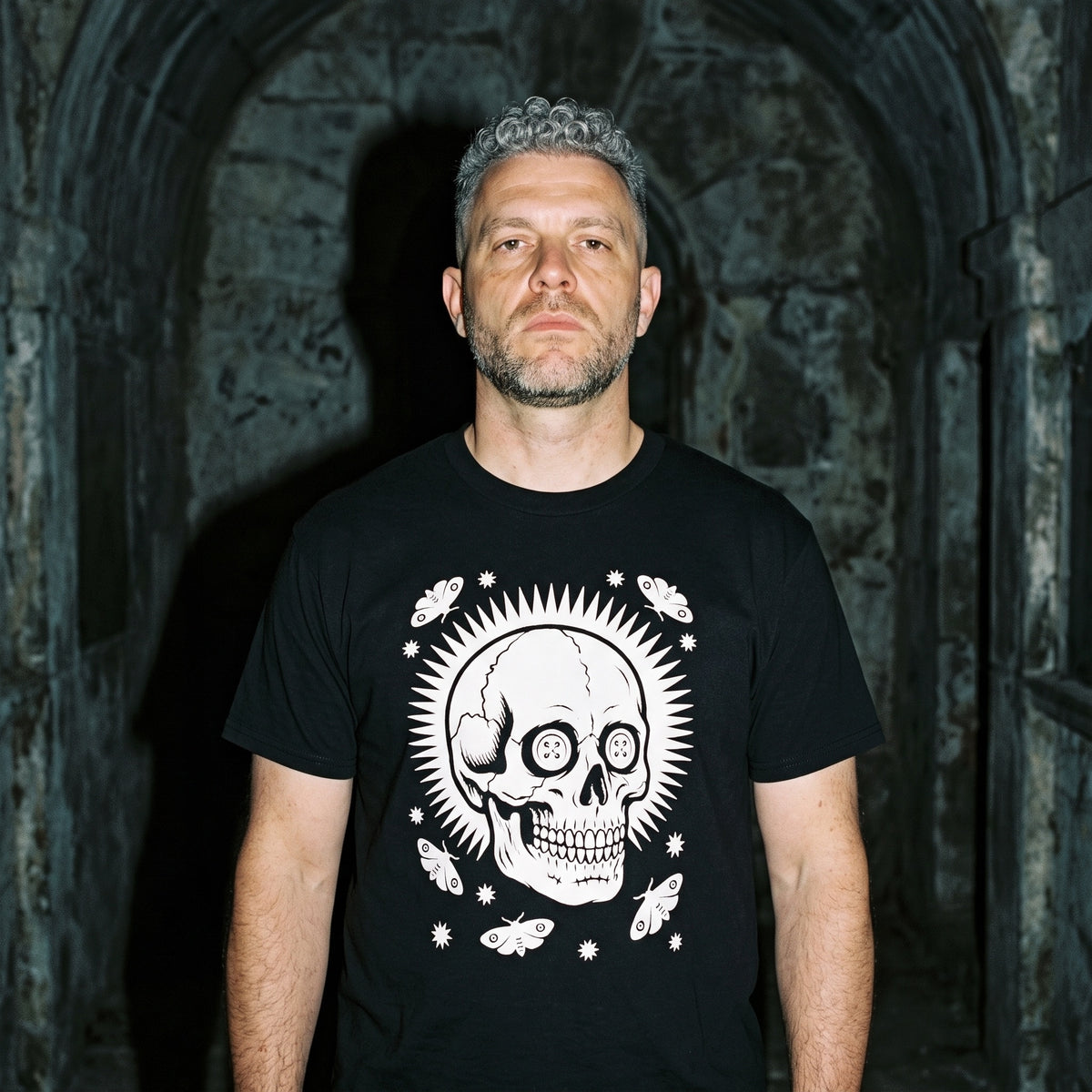 Man wearing the Memento Vivere black graphic tee