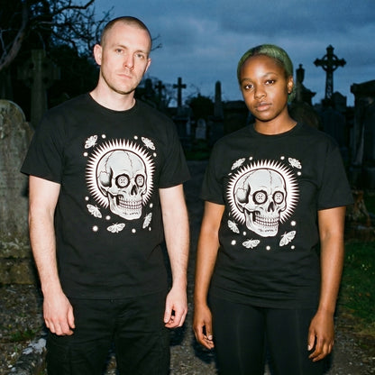 Two models wearing the Memento Vivere black graphic tee