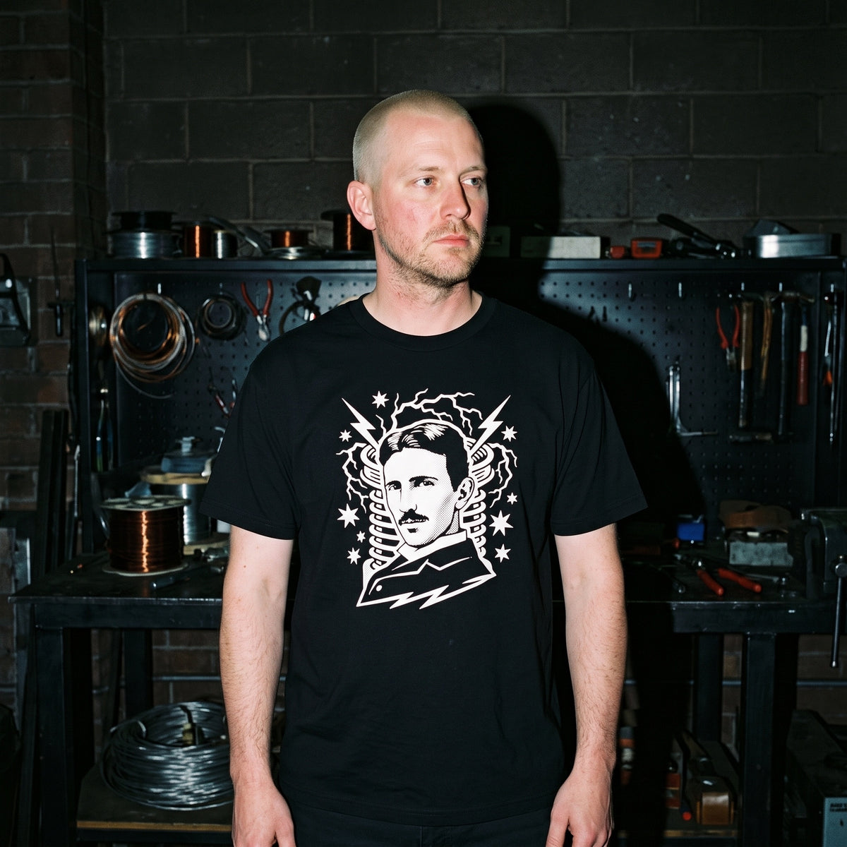 Man wearing the Nikola Tesla black graphic tee