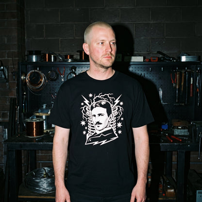 Man wearing the Nikola Tesla black graphic tee