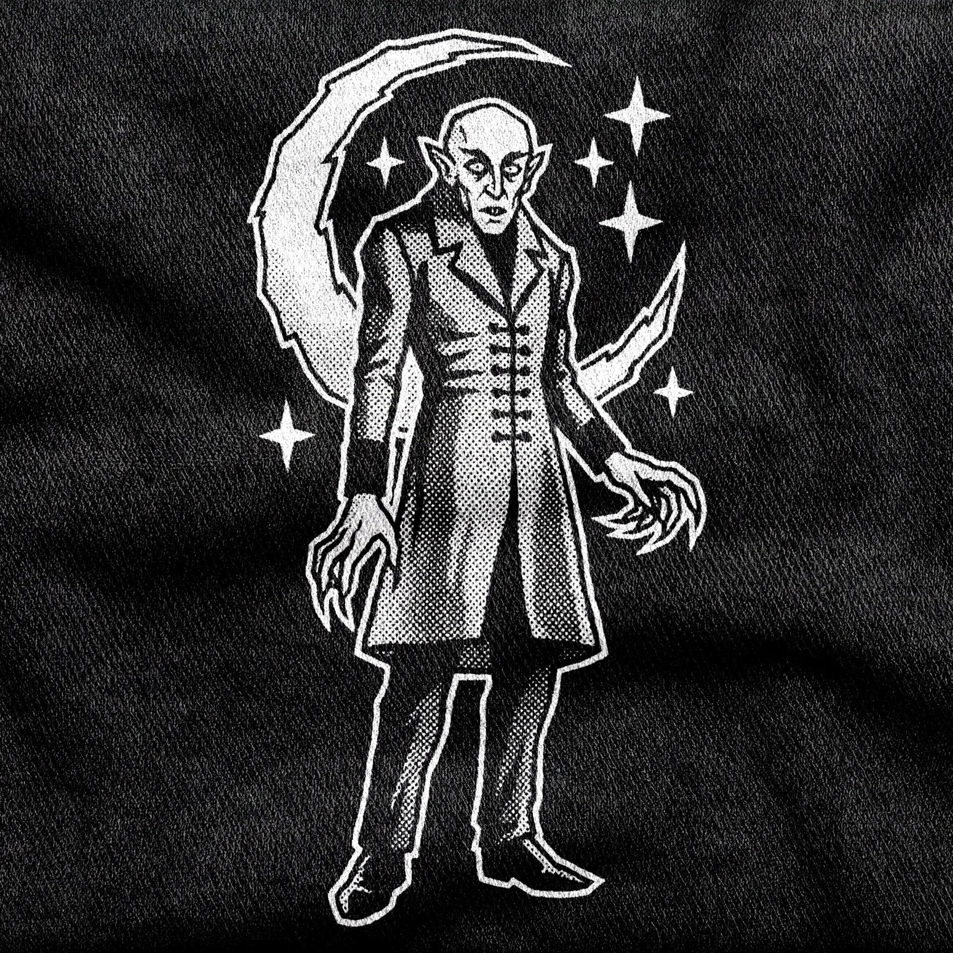 Nosferatu design printed on a black cotton tee, close-up