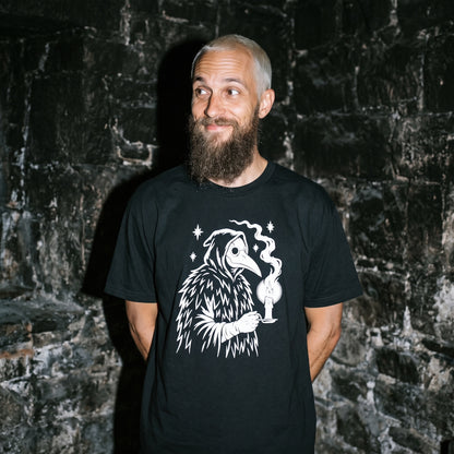 Man wearing the Plague Doctor black graphic tee