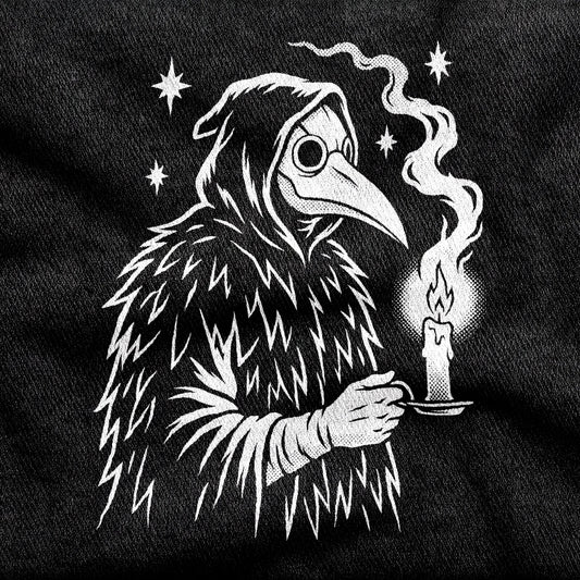 Plague Doctor design printed on a black cotton tee, close-up
