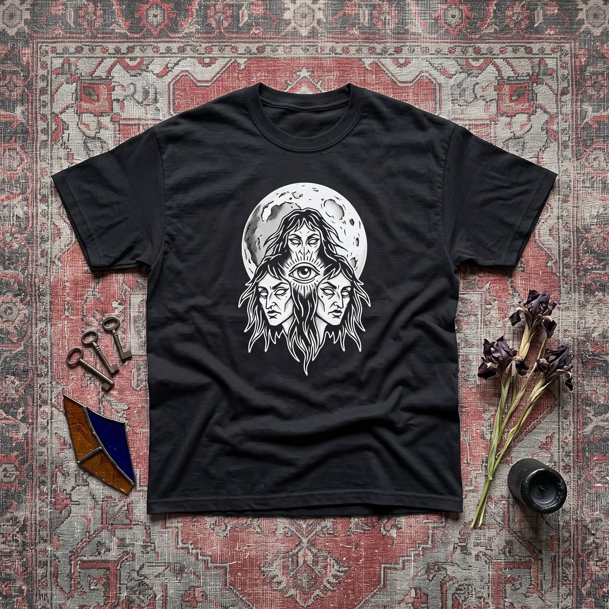 Three Mothers black graphic tee, styled flat lay