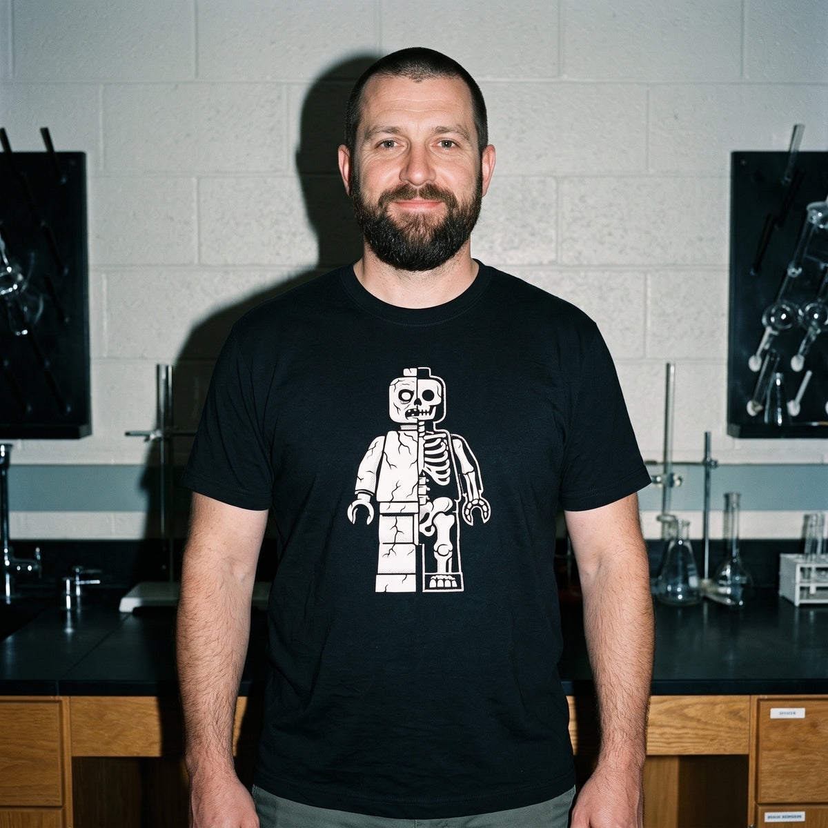 Man wearing the Zombie Let Go black graphic tee