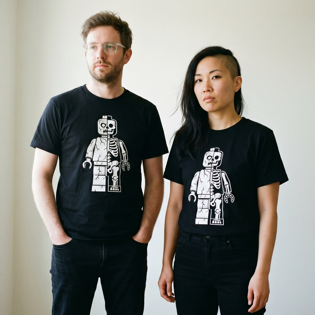 Two models wearing the Zombie Let Go black graphic tee