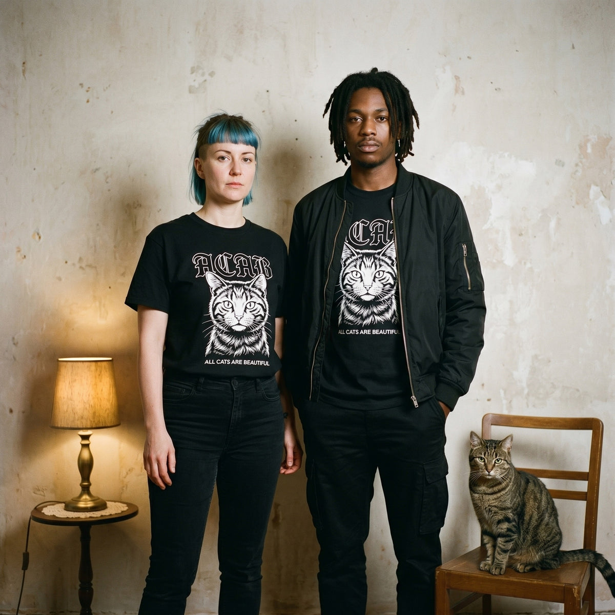 Two models wearing the ACAB black graphic tee