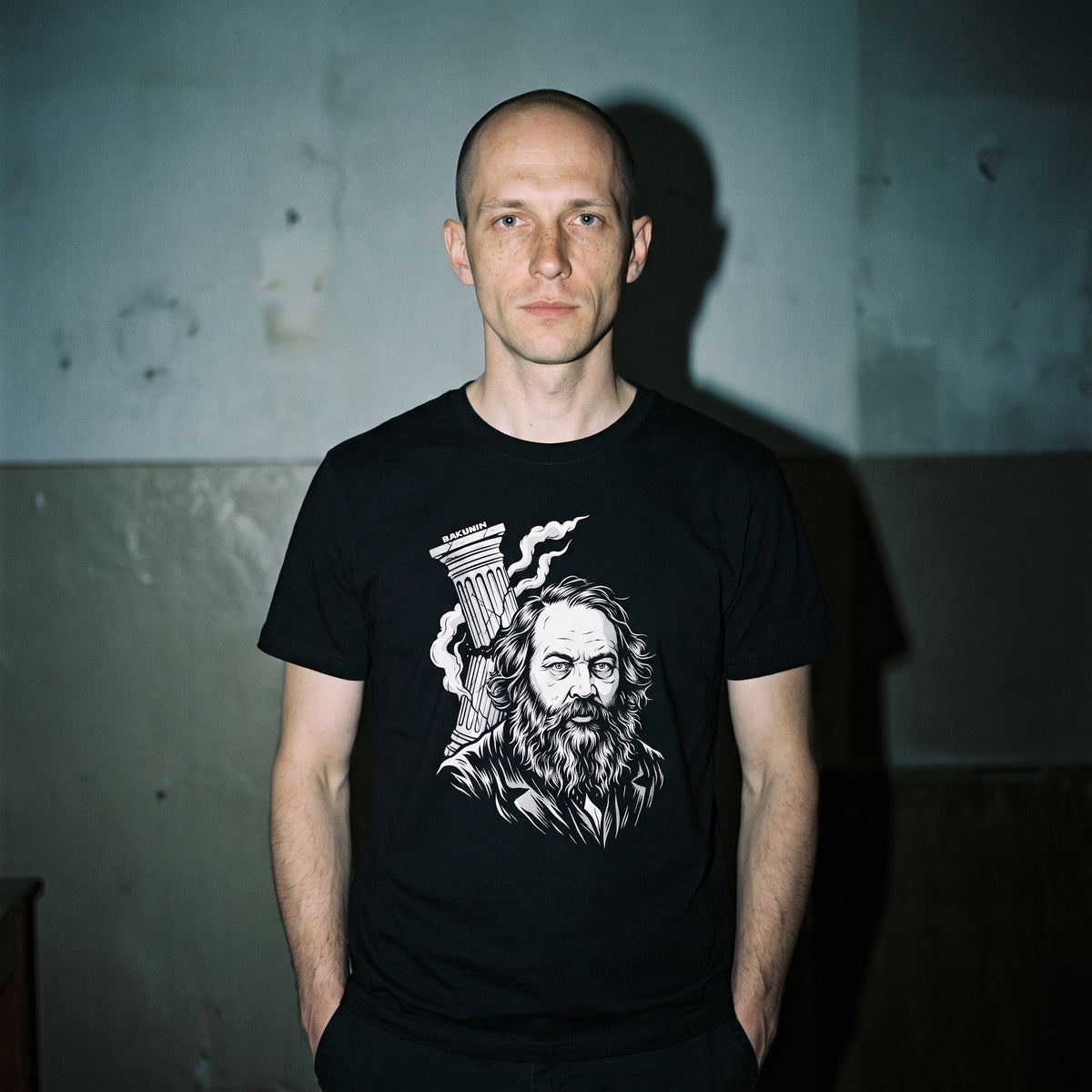 Man wearing the Mikhail Bakunin black graphic tee