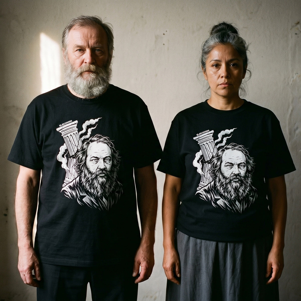 Two models wearing the Mikhail Bakunin black graphic tee