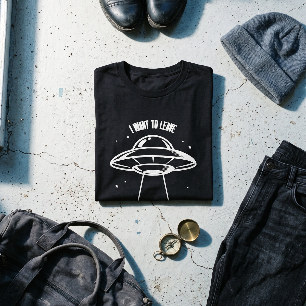 I Want to Leave black graphic tee styled in a flat lay with matching pieces