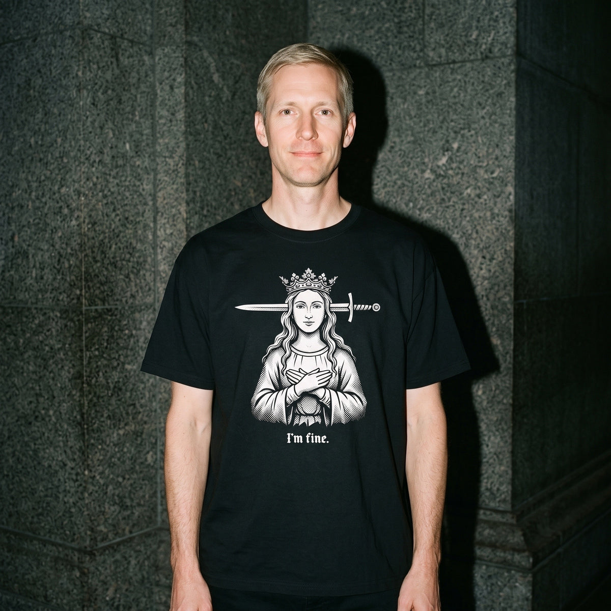 Man wearing the I'm Fine black graphic tee