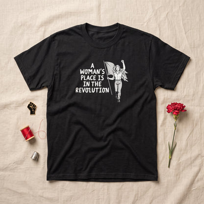 A Woman's Place is in the Revolution black graphic tee, styled flat lay