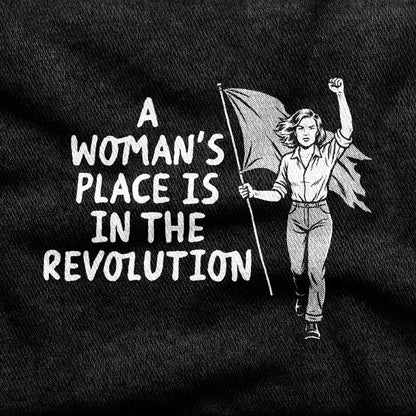 A Woman's Place is in the Revolution design printed on a black cotton tee, close-up