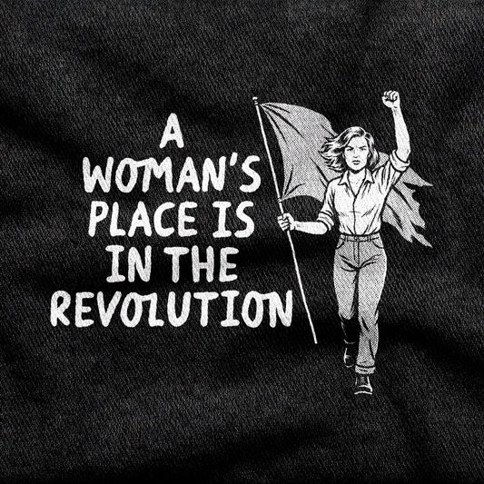 A Woman's Place is in the Revolution design printed on a black cotton tee, close-up