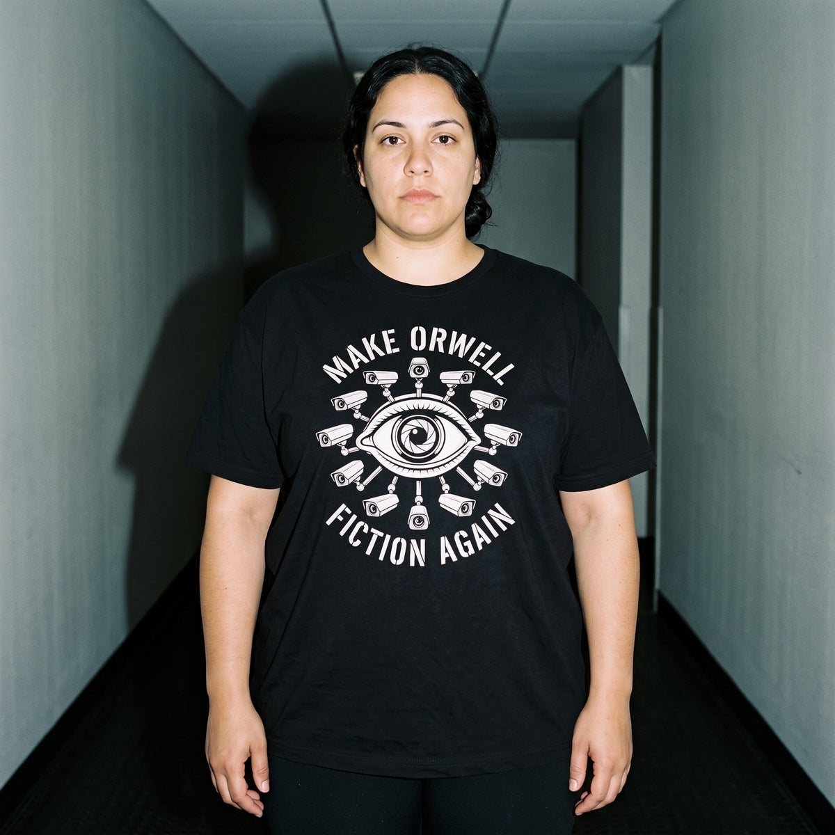 Woman wearing the Make Orwell Fiction Again black graphic tee