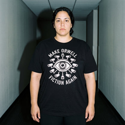 Woman wearing the Make Orwell Fiction Again black graphic tee