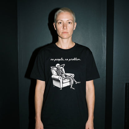 Woman wearing the No People, No Problem black graphic tee