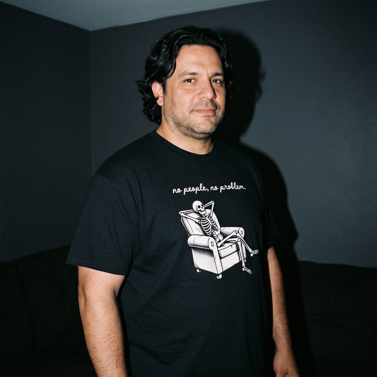 Man wearing the No People, No Problem black graphic tee