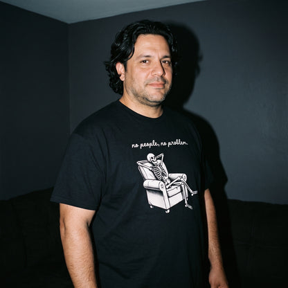 Man wearing the No People, No Problem black graphic tee