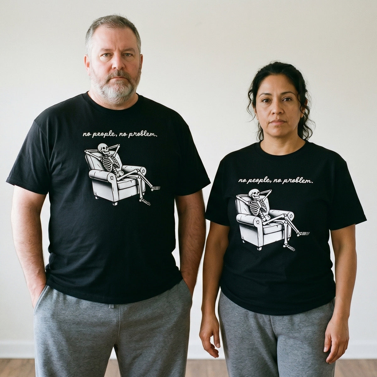 Two models wearing the No People, No Problem black graphic tee