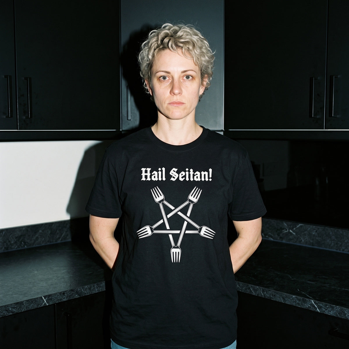 Woman wearing the Hail Seitan black graphic tee