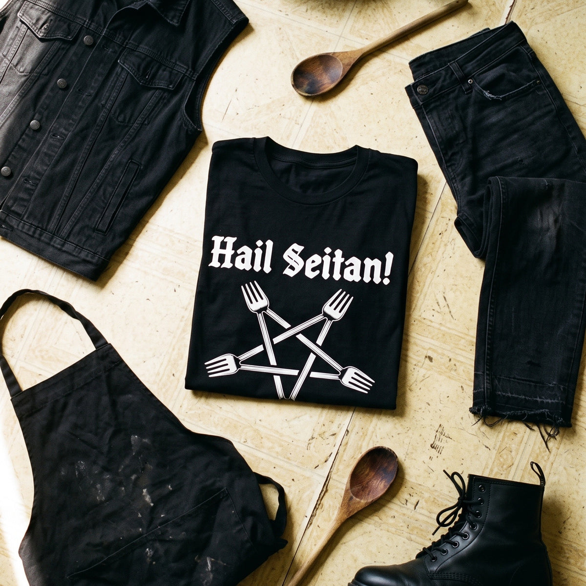 Hail Seitan black graphic tee styled in a flat lay with matching pieces