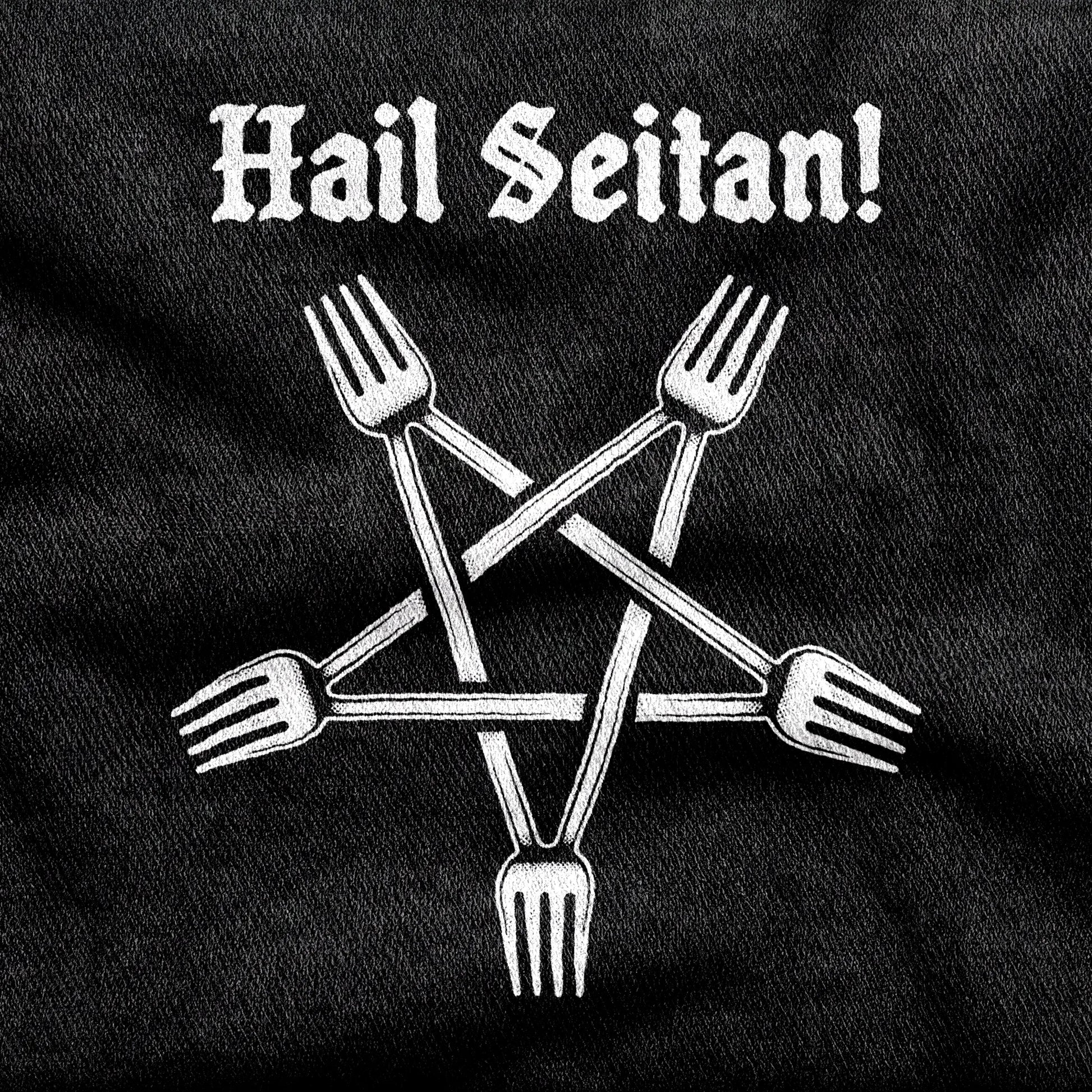 Hail Seitan design printed on a black cotton tee, close-up