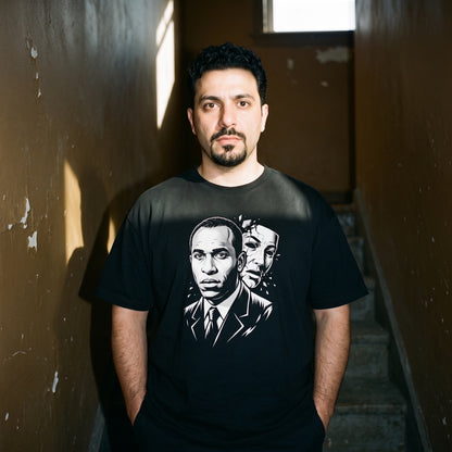 Man wearing the Frantz Fanon black graphic tee