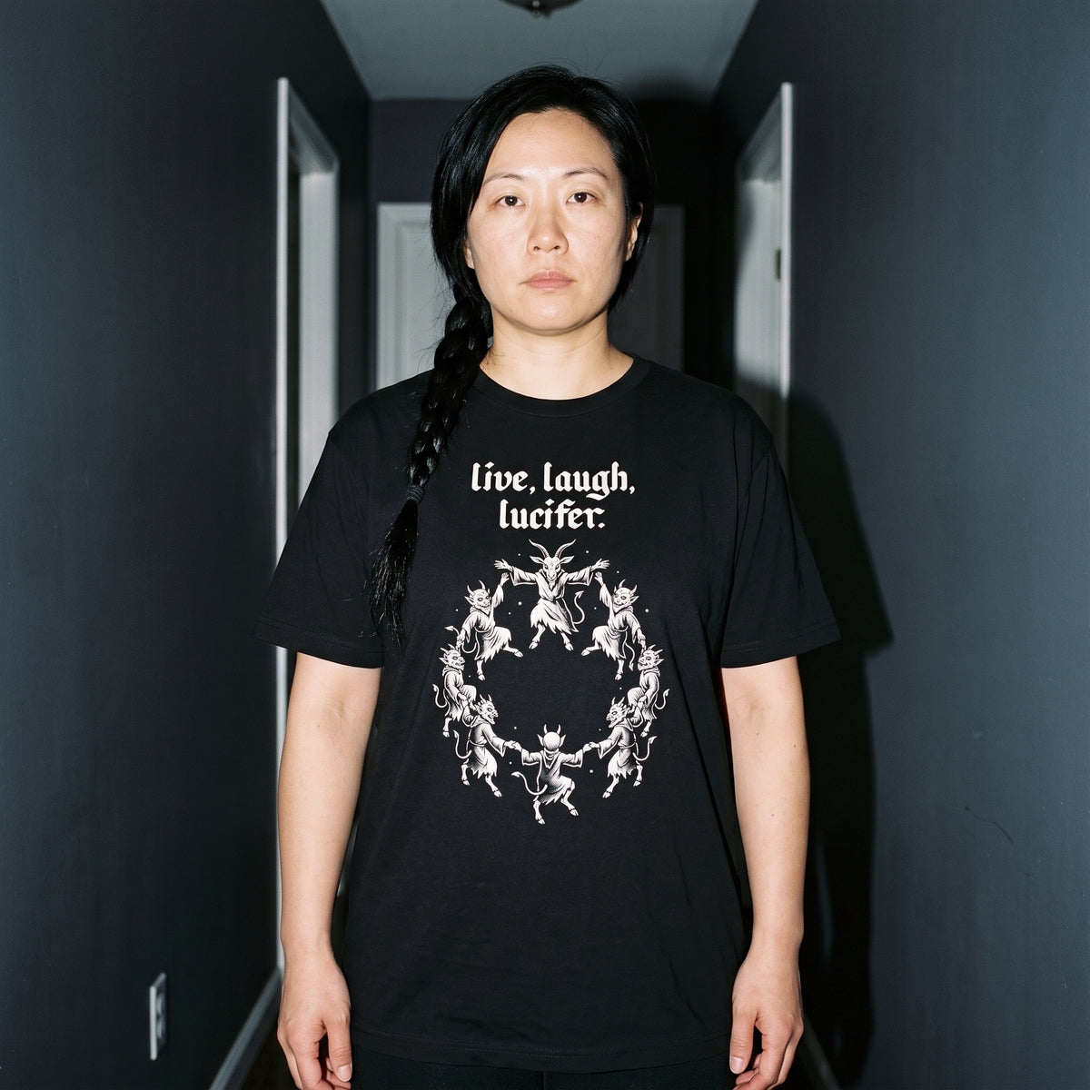 Woman wearing the Live Laugh Lucifer black graphic tee