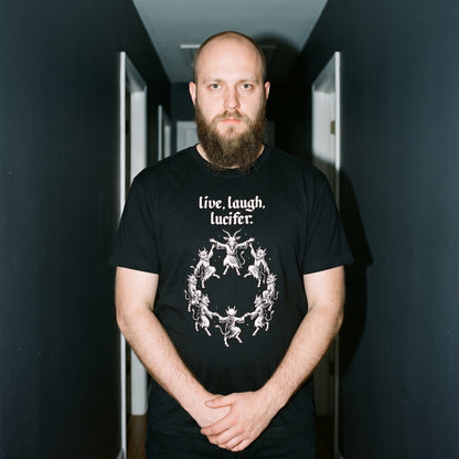 Man wearing the Live Laugh Lucifer black graphic tee