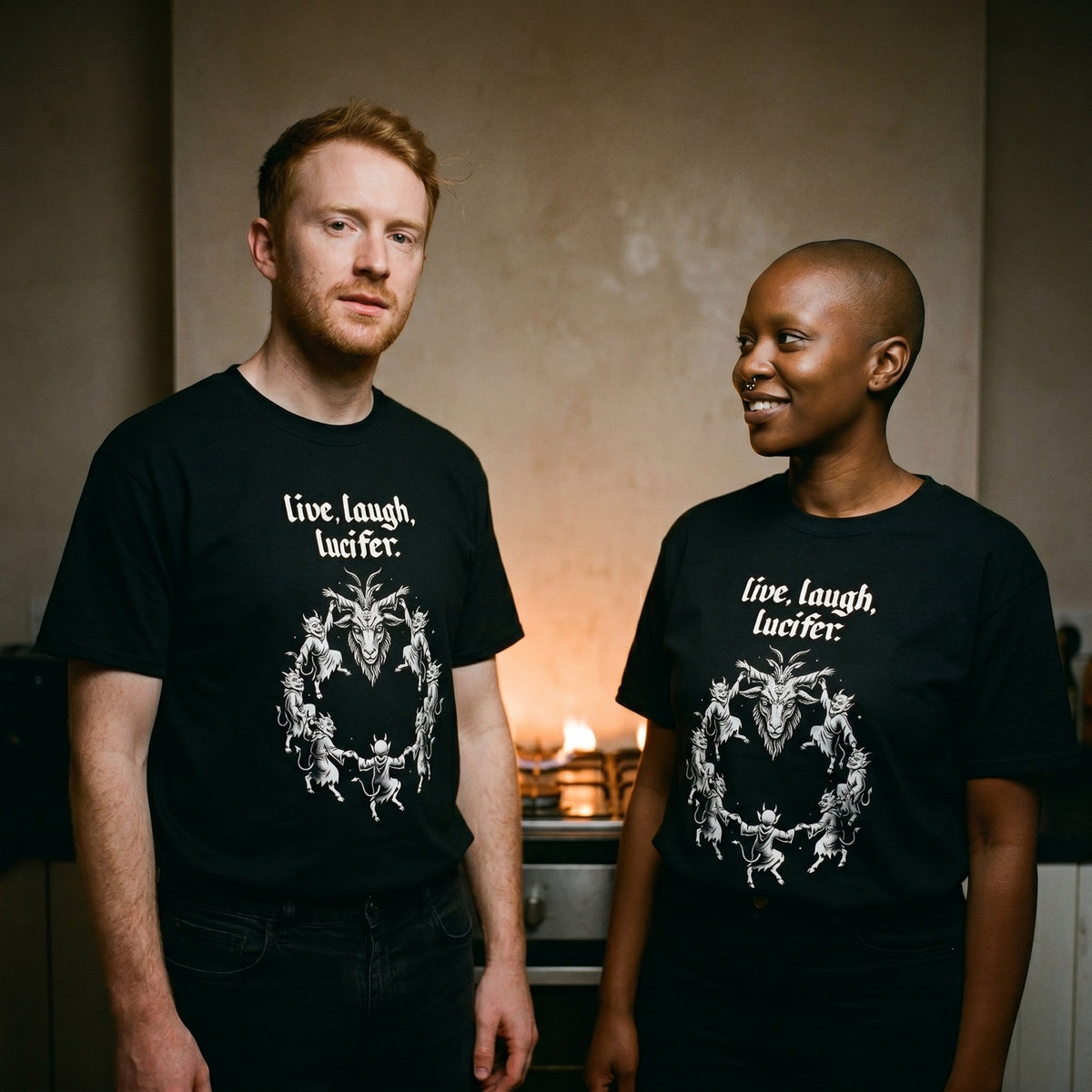 Two models wearing the Live Laugh Lucifer black graphic tee